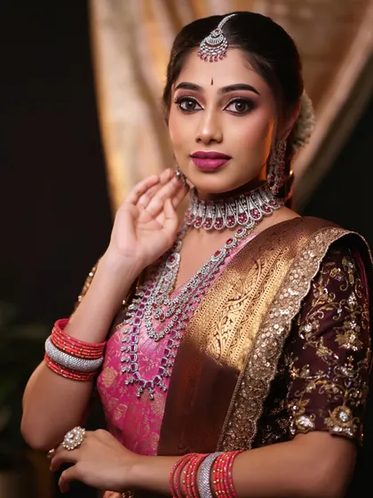 A classic portrait pose, highlighting the beautiful jewellery and the soft, glamorous makeup. The look is perfect for a reception or engagement.