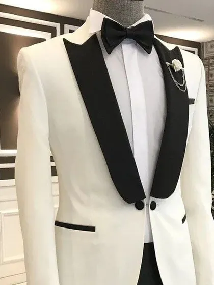 Another view of our popular white tuxedo with contrasting black shawl lapels. This piece comes with a stylish chain accessory for that extra touch of class.
