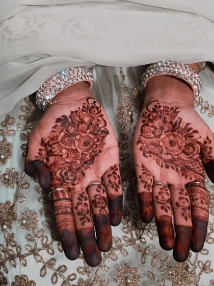 The final stain on my friend's hands. The deep color makes the floral clusters on her palms really stand out.