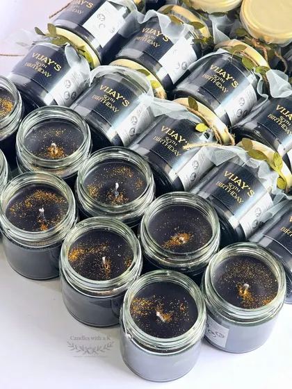 An order of 40 large, 200ml scented soy wax candles for Vijay's 50th birthday, featuring a sophisticated black and gold theme.