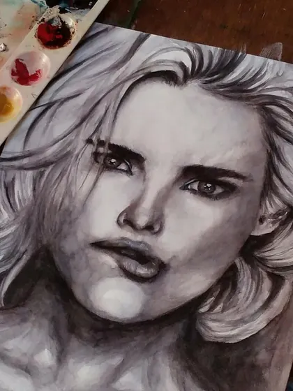 A powerful black and white watercolor portrait capturing an intense and slightly fierce expression.