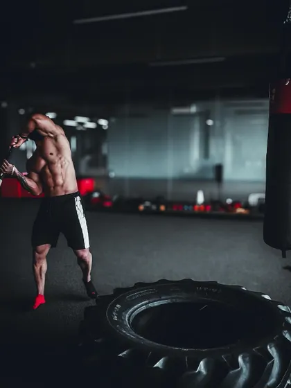 Preparing for a sledgehammer strike. This type of functional training builds raw, practical strength that translates outside of the gym.