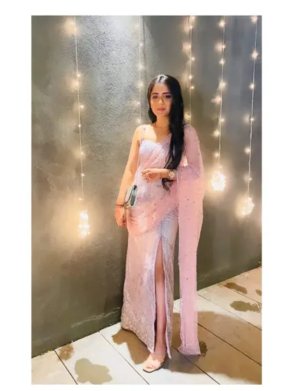 A modern and glamorous look for a cocktail party. This client is wearing a heavily embellished slit skirt set in a lovely lavender shade, complete with a stylish draped dupatta.
