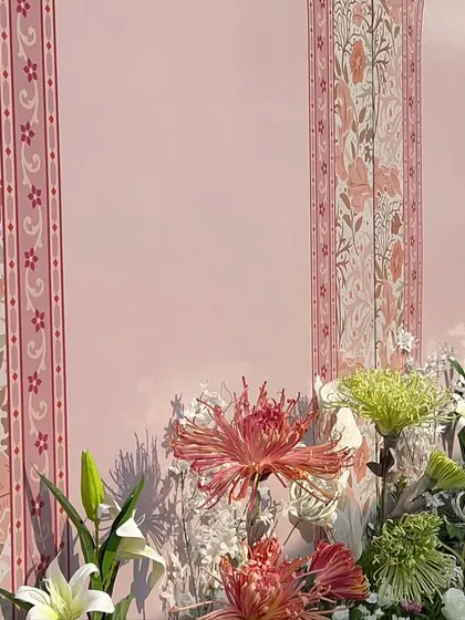 A close-up of the custom-printed wall panels, featuring beautiful floral and architectural motifs in a soft color palette.