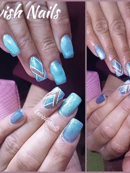 A striking geometric design in blue and rose gold glitter on shimmery blue square nails.