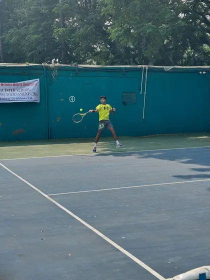 A player in action during the Inter School Tennis Tournament, showing the dynamic movement and agility required for competitive tennis.