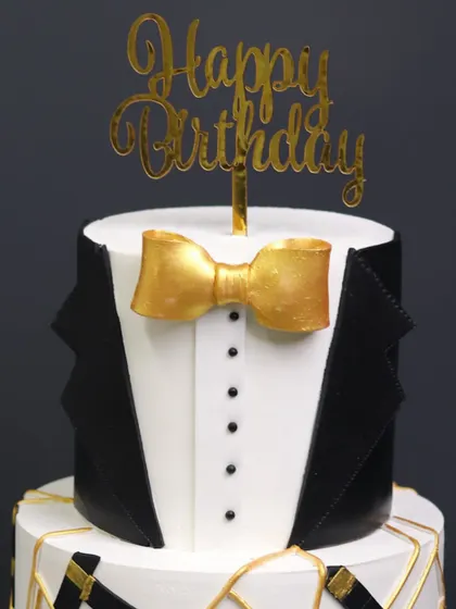 Another close-up of the tuxedo cake, showing the clean lines and elegant design.