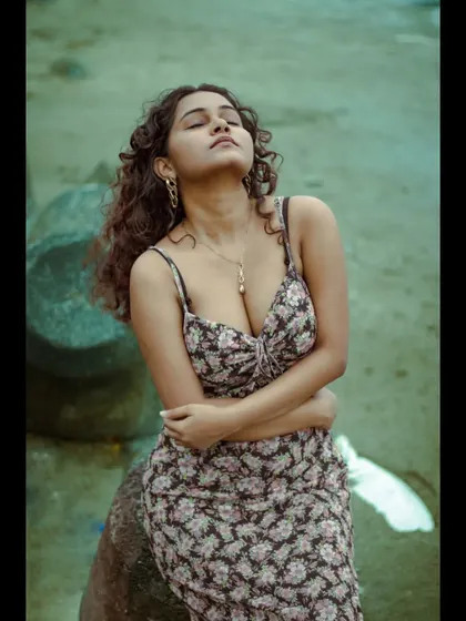 This pose, with eyes closed and a serene expression, captures a moment of peace. It's a beautiful, emotive shot that adds depth to a personal portrait or modeling series.