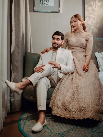 A regal portrait of the couple, Gaurav and Asen, showcasing the bride's stunning lehenga and the groom's coordinated sherwani.