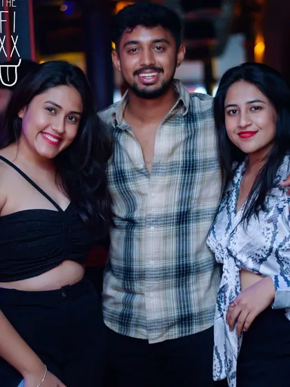 A great shot of some friends enjoying the party at The Fixx. The more, the merrier!