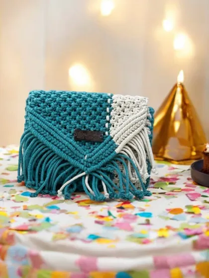 A two-tone sling bag with fringe, captured in a fun, celebratory setting. I can make this in any color combination you like!