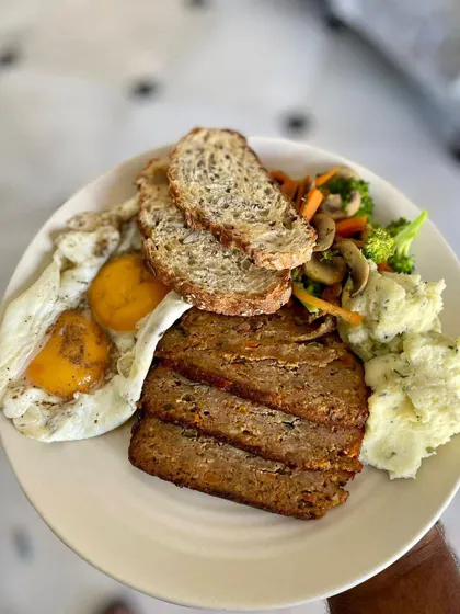 This is how one of my customers enjoys the pork meatloaf for a power packed breakfast. It’s served with runny eggs, sautéed veggies, multigrain sourdough, and creamy mashed potatoes.