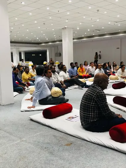 Participants deeply engaged in a listening and breathing exercise during the workshop. We teach foundational techniques that have benefits beyond just singing.