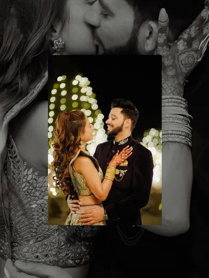 An intimate, romantic portrait of the couple against a backdrop of bokeh lights. The black and white overlay adds an artistic, dreamy quality.