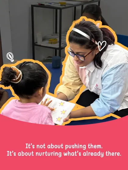 Our approach is not about pushing children, but about nurturing what's already there. An instructor gently guides a child through a star-matching activity, fostering a safe and loving environment where confidence can blossom.