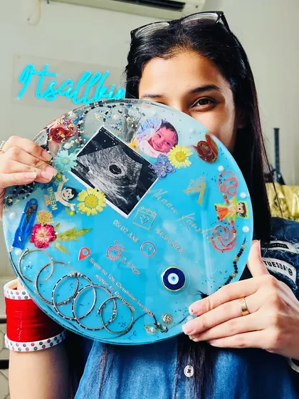 A peek at the finished baby detail frame. The neon sign of my brand in the background is a reminder that every piece I make is 'all kinda lit' with love and memories.