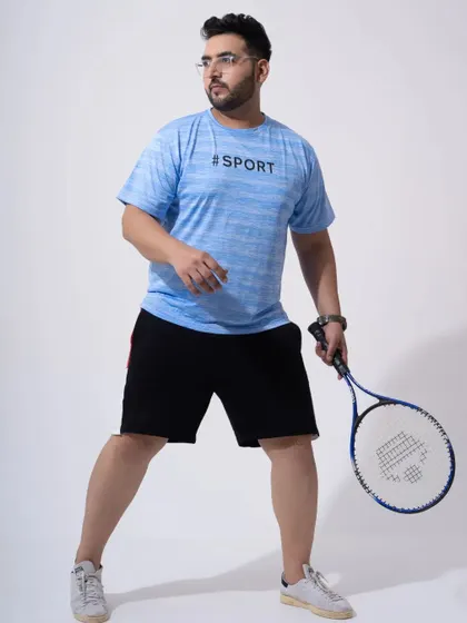 An e-commerce shot for a men's sportswear brand. Including props like a tennis racket helps to contextualize the product and appeal to the target audience.