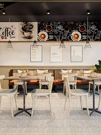 This angle showcases the coffee-themed wall art and layered lighting scheme that contribute to the cafe's cozy and branded atmosphere.
