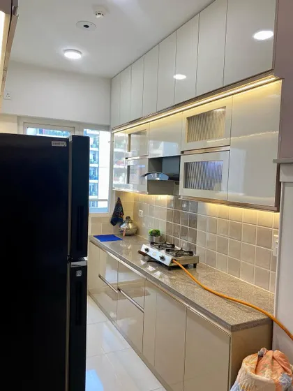 This angle shows the layout of the kitchen, with the sink on one side and the cooking range on the other, creating an efficient workspace.