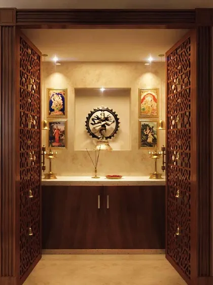 A pooja room is the heart of a home. We design sacred spaces that are both beautiful and tranquil, like this unit featuring intricate CNC-carved doors, warm spotlighting, and a serene backdrop for prayer and meditation.