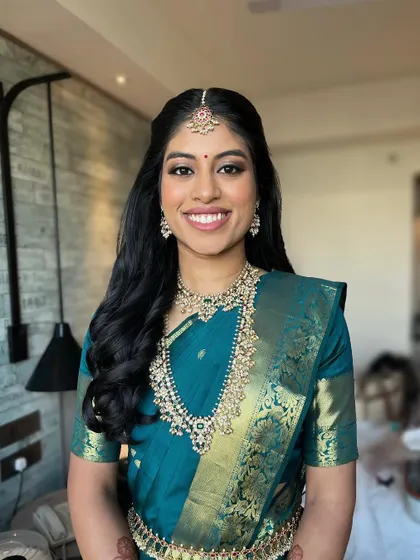 A final portrait of the stunning Tamil bride. The makeup is soft, glowing, and perfectly balanced, letting her natural beauty shine through.
