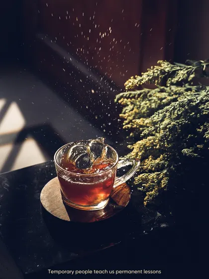 The dramatic play of light and shadow on a cup of iced tea. I used the harsh sunlight to create this high-contrast, moody shot, capturing the splash of the water.