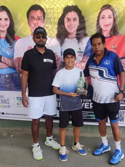 A young winner is recognized for his performance in the TPL-ITA tournament. These moments highlight the culmination of hard work and our dedication to celebrating player success.