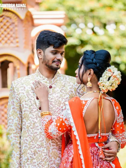 A candid-style shot for a couple's pre-wedding shoot, featuring coordinated ethnic attire. This shows our versatility in capturing fashion in a romantic context.