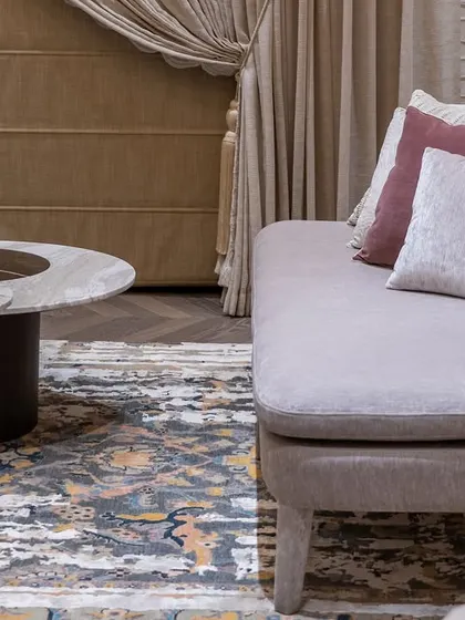 A detail shot of the daybed and custom marble-inlaid coffee table, showcasing our commitment to bespoke furniture and high-quality materials.