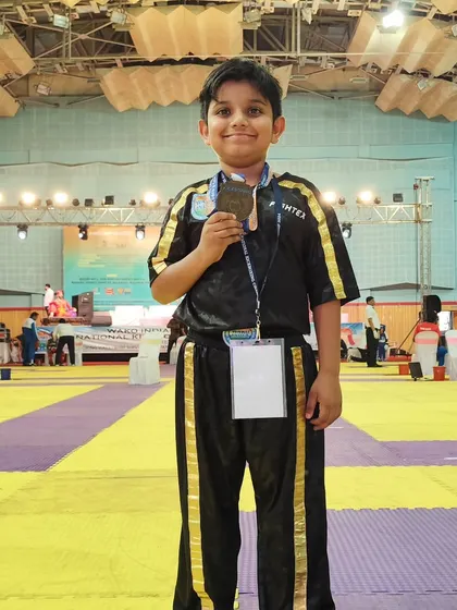 Abeer stands confidently with his national bronze medal. This experience at the WAKO India championship is a stepping stone for his future in the sport.
