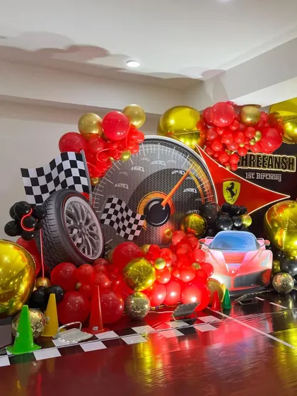 Another angle of the dynamic Ferrari stage, capturing the full spread of balloons and props.