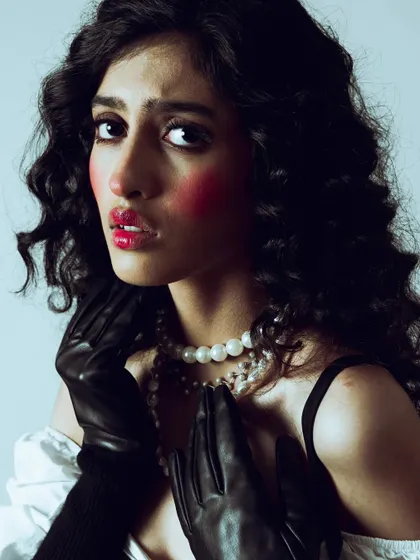This shot captures the theatrical and emotive quality of the makeup, perfect for a conceptual editorial story.