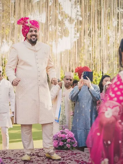 The groom's first look at his bride. Arjun's happy expression says it all as Nerrisa walks towards him.