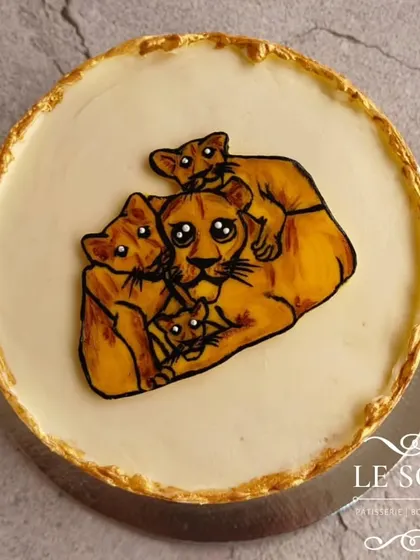 This cake was for Diwali, and I'm so grateful I got to make it. It's a half-kg Vanilla Chocolate cake with a hand-painted lioness and cubs, symbolizing family and love.