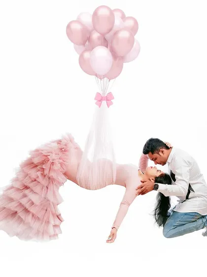 A little creative magic to make you feel like you're levitating. This fun edit with the pink balloons adds a playful and whimsical touch to a romantic couple's portrait.