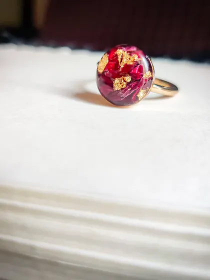 Another view of the custom rose-in-resin ring. This adjustable ring is a beautiful way to carry a small piece of a special memory with you always.