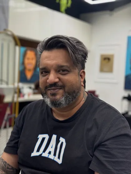 The client looking happy and confident with his new, premium salt and pepper style.