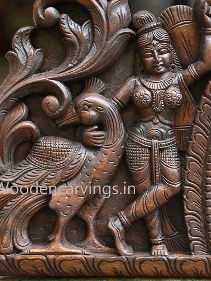 Another attendant with a peacock from the Krishna panel, mirroring the other side to create a balanced and harmonious design.
