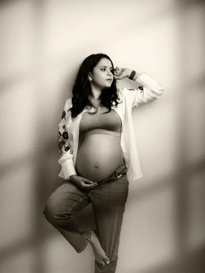 Capturing life's precious moments. This beautiful sepia-toned shot, with its delicate shadows, creates a truly timeless piece of art.