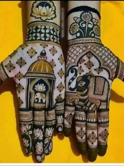 A beautiful design featuring an elephant inside a domed palace window on the palm. The fingertips are decorated with lotus motifs, combining several auspicious symbols in one elegant design.
