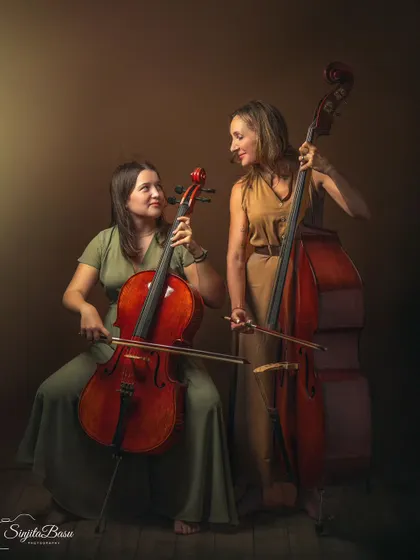 Photographing a mother and daughter with their instruments was a dream. The cello and double bass add such a unique, personal layer to their story, creating a portrait that is about their shared passion and connection.
