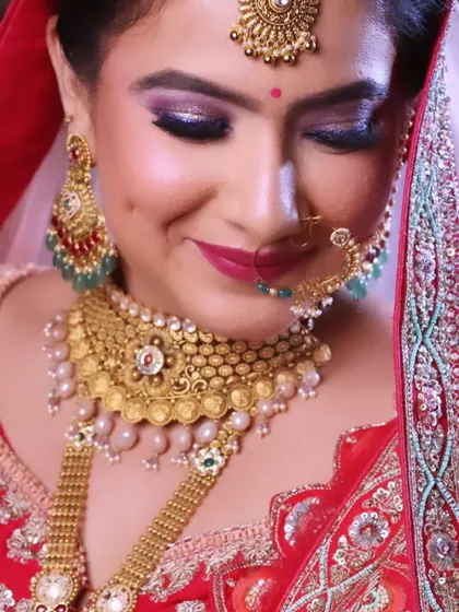 The smile of a happy bride says it all. This close up shows the detailed eye makeup and the perfect lip color.