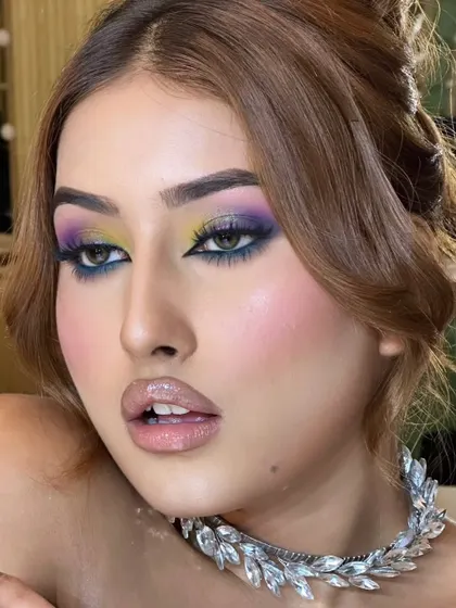A close-up of the celestial eye makeup. The colour placement is strategic to create a multi-dimensional and captivating effect.