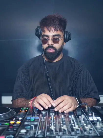Focused and in the zone. This is me at my workstation, my Pioneer DJ console. I use only industry-standard equipment to ensure the sound is always perfect and the music flows seamlessly.