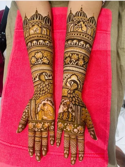 A beautiful bridal design with personalized initials inside the palace windows. The palms feature a couple portrait and large, elegant peacock motifs.