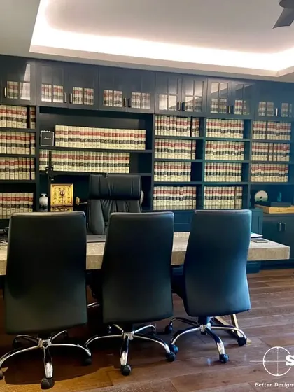 A custom-built library and desk area for a law office. The floor-to-ceiling shelving provides ample storage for legal books and files, creating a space that is both functional and traditionally authoritative.