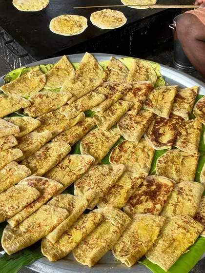 Freshly made obbattu (holige) ready to be served. This traditional sweet flatbread is a favourite at our live counters during festivals and weddings.
