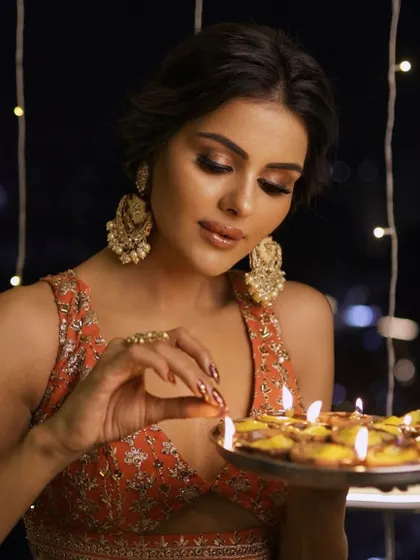 A touch of glam to match the Diwali glow. The makeup is warm and radiant, perfect for celebrating the festival of lights.