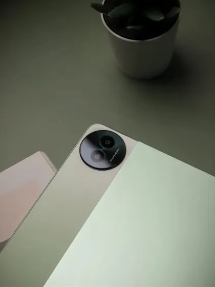 A close up detail shot of the realme Pad 2's camera and logo, emphasizing the product's design features.