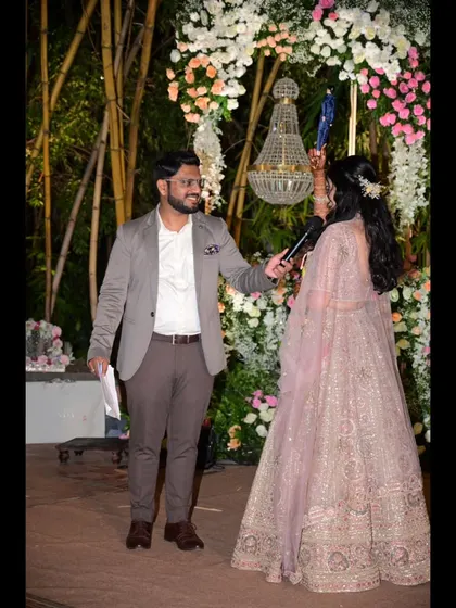 Engaging with the bride during a fun segment on stage. I love creating moments that put the spotlight on the couple.
